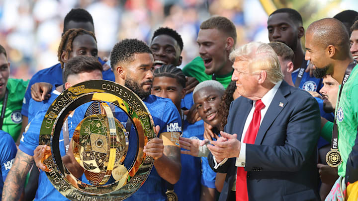 Chelsea captain Reece James looks at Donald Trump during the 2025 Club World Cup trophy lift.