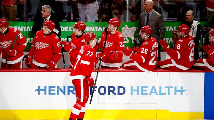 Mar 4, 2026; Detroit, Michigan, USA;  Detroit Red Wings defenseman Simon Edvinsson (77) receives congratulations from teammates after scoring in the first period against the Vegas Golden Knights at Little Caesars Arena. Mandatory Credit: Rick Osentoski-Imagn Images