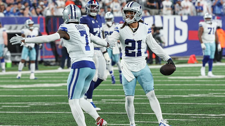 Dallas Cowboys cornerback Stephon Gilmore celebrates his interception against the Giants with Trevon Diggs.
