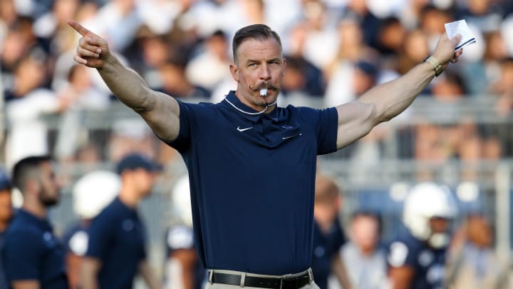 Penn State strength coach Chuck Losey motions from the sideline during a college football game at Beaver Stadium. Penn State strength coach Chuck Losey motions from the sideline during a college football game at Beaver Stadium.