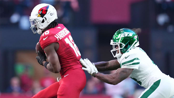 Nov 10, 2024; Glendale, Arizona, USA; Arizona Cardinals wide receiver Marvin Harrison Jr. (18) makes a catch against New York Jets cornerback D.J. Reed (4) during the first half at State Farm Stadium. Mandatory Credit: Joe Camporeale-Imagn Images