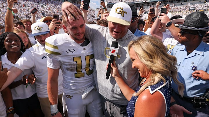 Sep 13, 2025; Atlanta, Georgia, USA; Georgia Tech Yellow Jackets quarterback Haynes King (10) and head coach Brent Key talk to a reporter after a victory over the Clemson Tigers at Bobby Dodd Stadium at Hyundai Field. Mandatory Credit: Brett Davis-Imagn Images