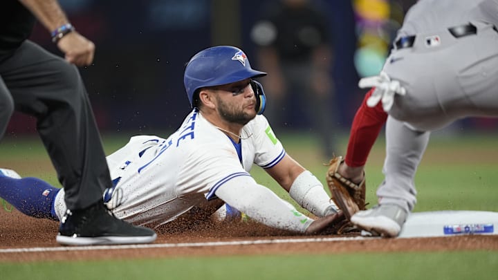 Apr 29, 2025; Toronto, Ontario, CAN; Toronto Blue Jays shortstop Bo Bichette (11) gets caught trying to steal third base against Boston Red Sox third baseman Alex Bregman (2) during the first inning at Rogers Centre. Mandatory Credit: John E. Sokolowski-Imagn Images Apr 29, 2025; Toronto, Ontario, CAN; Toronto Blue Jays shortstop Bo Bichette (11) gets caught trying to steal third base against Boston Red Sox third baseman Alex Bregman (2) during the first inning at Rogers Centre. Mandatory Credit: John E. Sokolowski-Imagn Images