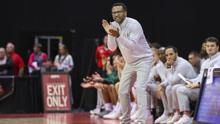 Nov 27, 2025; Kissimmee, Florida, USA; Miami (FL) Hurricanes head coach Jai Lucas erects after a basket against the Brigham Young University Cougars in the second half at State Farm Field House. Mandatory Credit: Nathan Ray Seebeck-Imagn Images Nov 27, 2025; Kissimmee, Florida, USA; Miami (FL) Hurricanes head coach Jai Lucas erects after a basket against the Brigham Young University Cougars in the second half at State Farm Field House. Mandatory Credit: Nathan Ray Seebeck-Imagn Images
