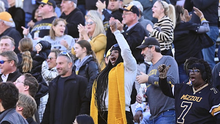 Nov 23, 2024; Starkville, Mississippi, USA; Missouri Tigers fans cheer after a touchdown against the Mississippi State Bulldogs during the first quarter at Davis Wade Stadium at Scott Field. Nov 23, 2024; Starkville, Mississippi, USA; Missouri Tigers fans cheer after a touchdown against the Mississippi State Bulldogs during the first quarter at Davis Wade Stadium at Scott Field.