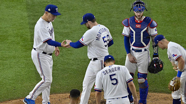Oct 28, 2023; Arlington, Texas, USA; Texas Rangers manager Bruce Bochy (15) takes the ball from