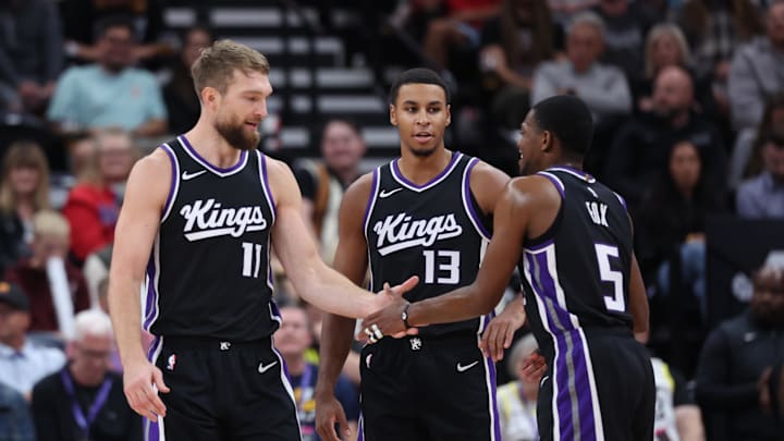 Oct 15, 2024; Salt Lake City, Utah, USA; Sacramento Kings forward Domantas Sabonis (11), forward Keegan Murray (13) and guard De'Aaron Fox (5) react to a play against the Utah Jazz during the second quarter at Delta Center. Mandatory Credit: Rob Gray-Imagn Images