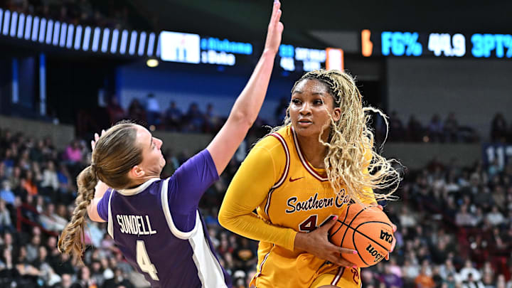 Mar 29, 2025; Spokane, WA, USA; Kansas State Wildcats guard Serena Sundell (4) takes a charge from USC Trojans forward Kiki Iriafen (44) during the second half of a Sweet 16 NCAA Tournament basketball game against the Kansas State Wildcats at Spokane Arena. Mandatory Credit: James Snook-Imagn Images Mar 29, 2025; Spokane, WA, USA; Kansas State Wildcats guard Serena Sundell (4) takes a charge from USC Trojans forward Kiki Iriafen (44) during the second half of a Sweet 16 NCAA Tournament basketball game against the Kansas State Wildcats at Spokane Arena. Mandatory Credit: James Snook-Imagn Images