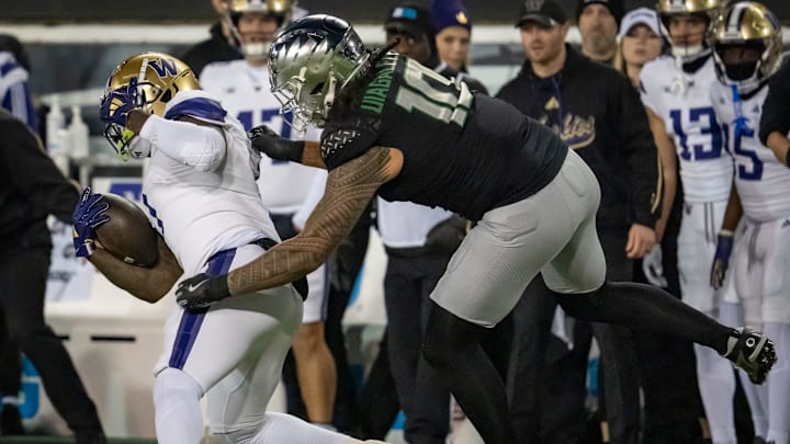 Oregon outside linebacker Matayo Uiagalelei brings down Washington running back Jonah Coleman as the No. 1 Oregon Ducks host the Washington Huskies Saturday, Nov. 30, 2024 at Autzen Stadium in Eugene, Ore.