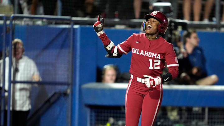 Oklahoma's Maya Bland (12) celebrates after hitting a three-run home run in the fourth inning of a college Bedlam softball game between the University of Oklahoma Sooners (OU) and the Oklahoma State University Cowgirls (OSU) at Devon Park in Oklahoma City, Wednesday, April 9, 2025. Oklahoma's Maya Bland (12) celebrates after hitting a three-run home run in the fourth inning of a college Bedlam softball game between the University of Oklahoma Sooners (OU) and the Oklahoma State University Cowgirls (OSU) at Devon Park in Oklahoma City, Wednesday, April 9, 2025.