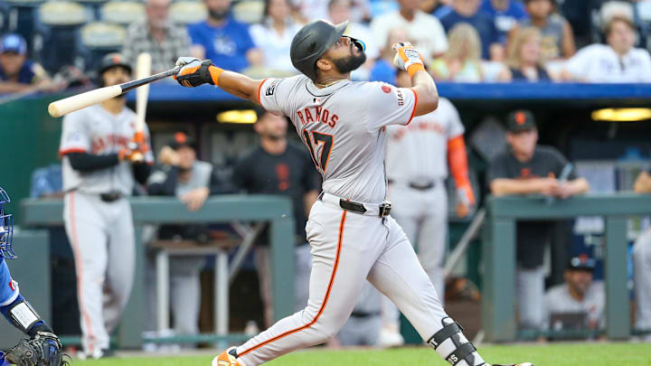 Sep 21, 2024; Kansas City, Missouri, USA; San Francisco Giants left fielder Heliot Ramos (17) watches a pop fly during the top of the eight inning against the Kansas City Royals at Kauffman Stadium.