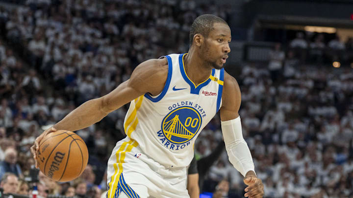 May 8, 2025; Minneapolis, Minnesota, USA; Golden State Warriors forward Jonathan Kuminga (00) dribbles the ball against the Minnesota Timberwolves in the second half during game two of the second round for the 2025 NBA Playoffs at Target Center. Mandatory Credit: Jesse Johnson-Imagn Images