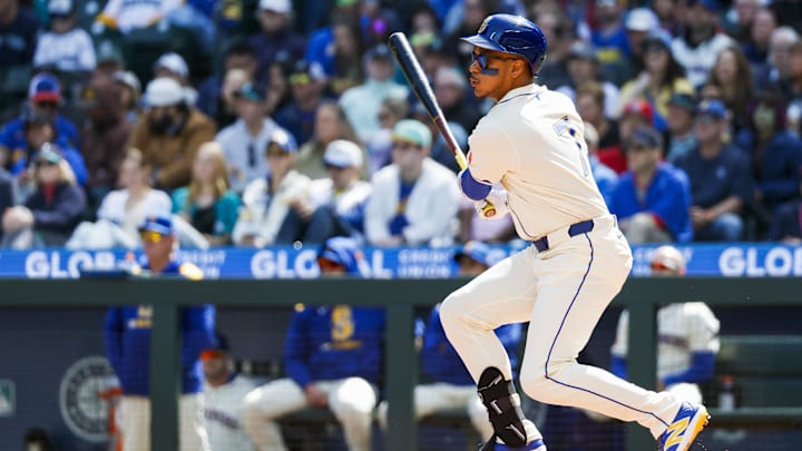 Seattle Mariners designated hitter Jorge Polanco hits a single during a game against the Texas Rangers on April 13 at T-Mobile Park.