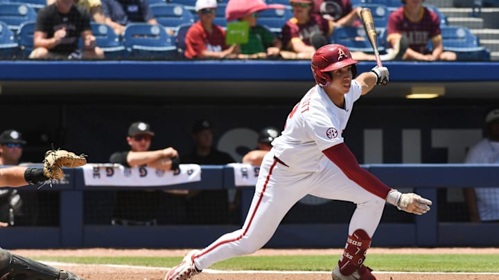 May 22 2024; Hoover, AL, USA; Arkansas batter Jared sprague-Lott serves a pitch into right field for a hit against South Carolina at the Hoover Met during the SEC Tournament.
