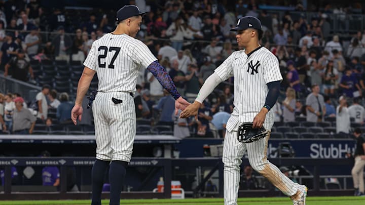 Aug 23, 2024; Bronx, New York, USA; New York Yankees designated hitter Giancarlo Stanton (27) celebrates with right fielder Juan Soto (22) Uafter defeating the Colorado Rockies at Yankee Stadium. Mandatory Credit: Vincent Carchietta-Imagn Images Aug 23, 2024; Bronx, New York, USA; New York Yankees designated hitter Giancarlo Stanton (27) celebrates with right fielder Juan Soto (22) Uafter defeating the Colorado Rockies at Yankee Stadium. Mandatory Credit: Vincent Carchietta-Imagn Images