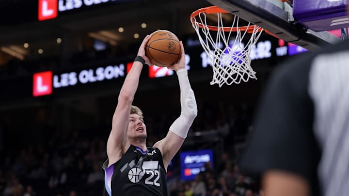 Mar 14, 2025; Salt Lake City, Utah, USA;  Utah Jazz forward Kyle Filipowski (22) attempts to dunk the ball during the first quarter against the Toronto Raptors at Delta Center. Mandatory Credit: Chris Nicoll-Imagn Images