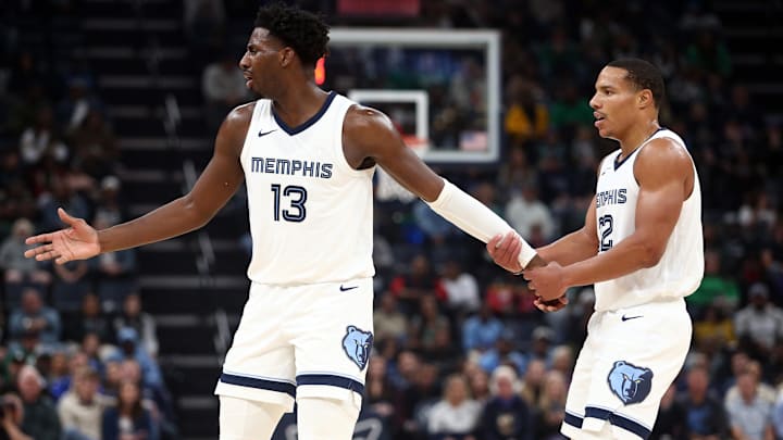 Nov 19, 2023; Memphis, Tennessee, USA; Memphis Grizzlies forward-center Jaren Jackson Jr. (13) is held back by Memphis Grizzlies guard Desmond Bane (22) after a foul call during the first half against the Boston Celtics at FedExForum. Mandatory Credit: Petre Thomas-Imagn Images