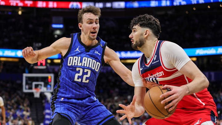 Orlando Magic forward Franz Wagner (22) defends Washington Wizards forward Tristan Vukcevic (00) during the second quarter at Kia Center.