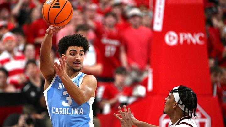 Feb 17, 2026; Raleigh, North Carolina, USA; North Carolina Tar Heels guard Derek Dixon (3) passes the ball at the half court against during the first half against the NC State Wolfpack Lenovo Center. Feb 17, 2026; Raleigh, North Carolina, USA; North Carolina Tar Heels guard Derek Dixon (3) passes the ball at the half court against during the first half against the NC State Wolfpack Lenovo Center.