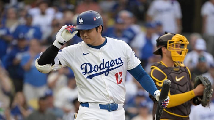 Oct 11, 2024; Los Angeles, California, USA; Los Angeles Dodgers designated hitter Shohei Ohtani (17) reacts at bat in the first inning against the San Diego Padres during game five of the NLDS for the 2024 MLB Playoffs at Dodger Stadium.