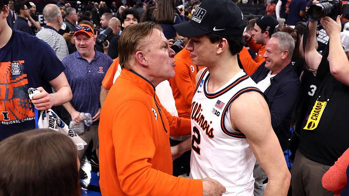 Mar 28, 2026; Houston, TX, USA; Illinois Fighting Illini head coach Brad Underwood and guard Andrej Stojakovic (2) celebrate after defeating the Iowa Hawkeyes in an Elite Eight game of the South Regional of the men's 2026 NCAA Tournament at Toyota Center. Mandatory Credit: Troy Taormina-Imagn Images