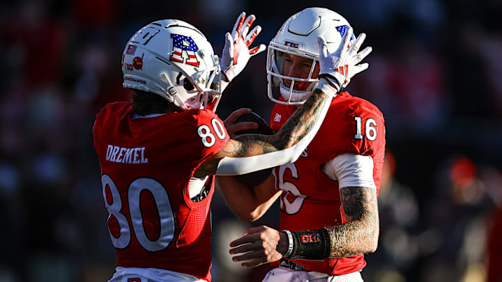 Rutgers Scarlet Knights quarterback Athan Kaliakmanis (16) celebrates with running back Jordan Smikle (80) Rutgers Scarlet Knights quarterback Athan Kaliakmanis (16) celebrates with running back Jordan Smikle (80)