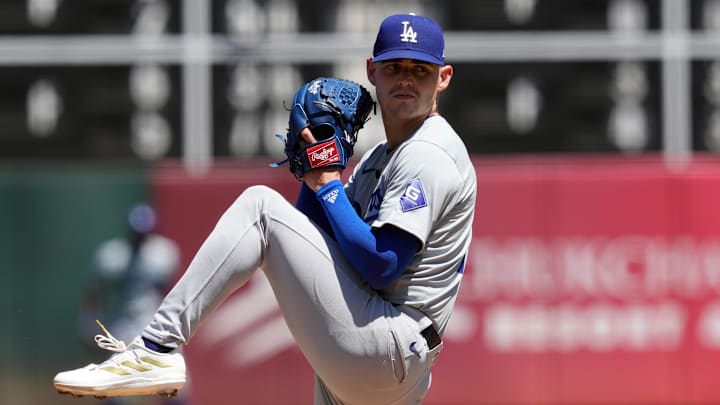Aug 4, 2024; Oakland, California, USA; Los Angeles Dodgers starting pitcher River Ryan (77) throws a pitch against the Oakland Athletics during the fourth inning at Oakland-Alameda County Coliseum. Mandatory Credit: Darren Yamashita-Imagn Images