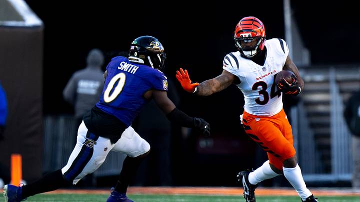 Baltimore Ravens inside linebacker Roquan Smith (0) goes to tackle Cincinnati Bengals running back Samaje Perine (34) in the third quarter of the NFL football game at Paycor Stadium in Cincinnati on Dec. 14, 2025. Baltimore Ravens inside linebacker Roquan Smith (0) goes to tackle Cincinnati Bengals running back Samaje Perine (34) in the third quarter of the NFL football game at Paycor Stadium in Cincinnati on Dec. 14, 2025.