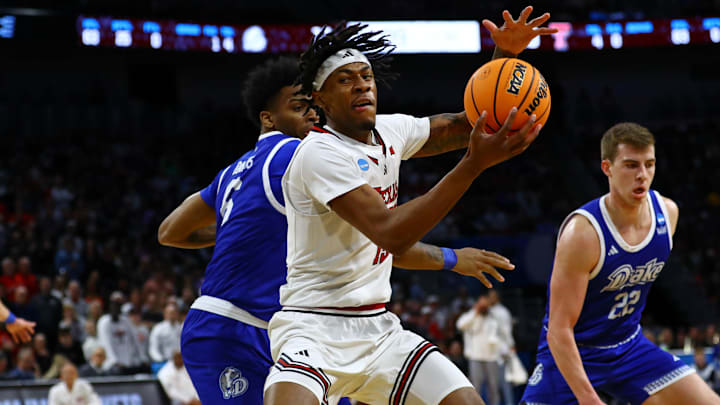 Mar 22, 2025; Wichita, KS, USA; Texas Tech Red Raiders forward JT Toppin (15) controls the ball against Drake Bulldogs guard Tavion Banks (6) during the first half at Intrust Bank Arena. Mandatory Credit: Nick Tre. Smith-Imagn Images