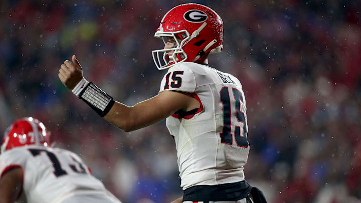 Georgia Bulldogs quarterback Carson Beck (15) gives direction prior to the snap during the second half against the Mississippi Rebels. Georgia Bulldogs quarterback Carson Beck (15) gives direction prior to the snap during the second half against the Mississippi Rebels.