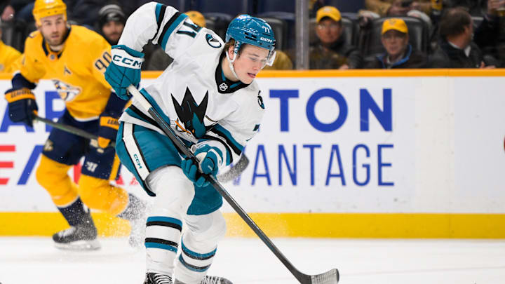 Jan 21, 2025; Nashville, Tennessee, USA;   San Jose Sharks center Macklin Celebrini (71) skates with the puck against the Nashville Predators during the second period at Bridgestone Arena. Mandatory Credit: Steve Roberts-Imagn Images