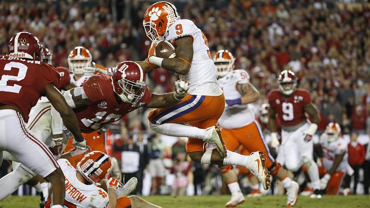 Clemson Tigers running back Wayne Gallman (9) runs against Alabama Crimson Tide linebacker Reuben Foster (10) Clemson Tigers running back Wayne Gallman (9) runs against Alabama Crimson Tide linebacker Reuben Foster (10)