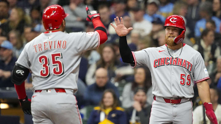 Apr 5, 2025; Milwaukee, Wisconsin, USA;  Cincinnati Reds catcher Jose Trevino (35) is greeted by center fielder Blake Dunn (59) after hitting a home run during the fourth inning against the Milwaukee Brewers at American Family Field. Mandatory Credit: Jeff Hanisch-Imagn Images