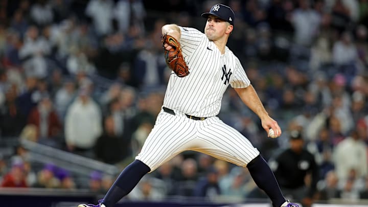Oct 14, 2024; Bronx, New York, USA; New York Yankees pitcher Carlos Rodon (55) pitches during the first inning against the Cleveland Guardians in game one of the ALCS for the 2024 MLB Playoffs at Yankee Stadium. 