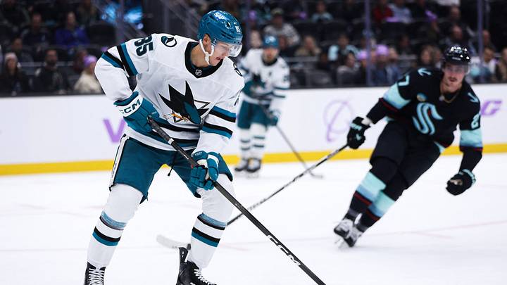 Nov 15, 2025; Seattle, Washington, USA; Former San Jose Sharks defenseman Shakir Mukhamadullin (85) controls the puck in the first period against the Seattle Kraken at Climate Pledge Arena. Mandatory Credit: Kevin Ng-Imagn Images Nov 15, 2025; Seattle, Washington, USA; Former San Jose Sharks defenseman Shakir Mukhamadullin (85) controls the puck in the first period against the Seattle Kraken at Climate Pledge Arena. Mandatory Credit: Kevin Ng-Imagn Images