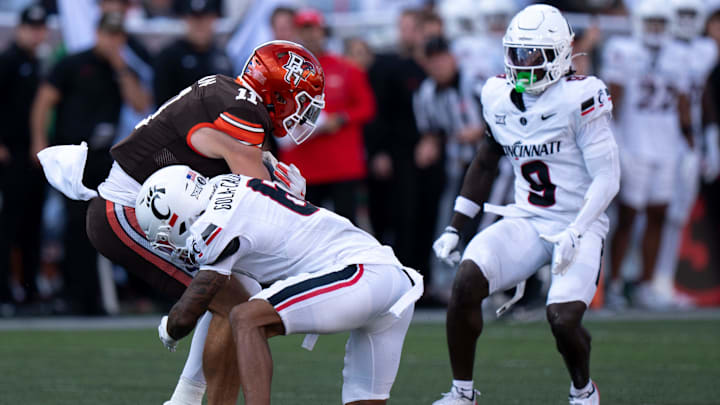Bowling Green Falcons receiver Finn Hogan (11) is tackled by Cincinnati Bearcats safety Trevon Gola-Callard (6) in the third quarter of the NCAA football game between the Cincinnati Bearcats and Bowling Green Falcons at Nippert Stadium in Cincinnati on Sept. 6, 2025. Bowling Green Falcons receiver Finn Hogan (11) is tackled by Cincinnati Bearcats safety Trevon Gola-Callard (6) in the third quarter of the NCAA football game between the Cincinnati Bearcats and Bowling Green Falcons at Nippert Stadium in Cincinnati on Sept. 6, 2025.