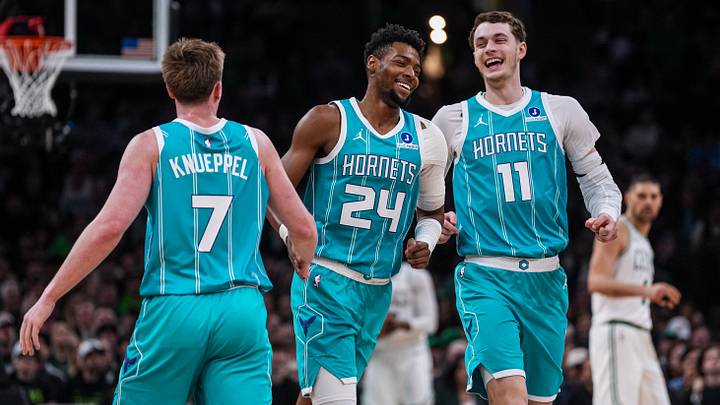Apr 7, 2026; Boston, Massachusetts, USA; Charlotte Hornets center Ryan Kalkbrenner (11), forward Brandon Miller (24) and guard Kon Knueppel (7) react after a basket against the Boston Celtics in the second quarter at TD Garden. Mandatory Credit: David Butler II-Imagn Images