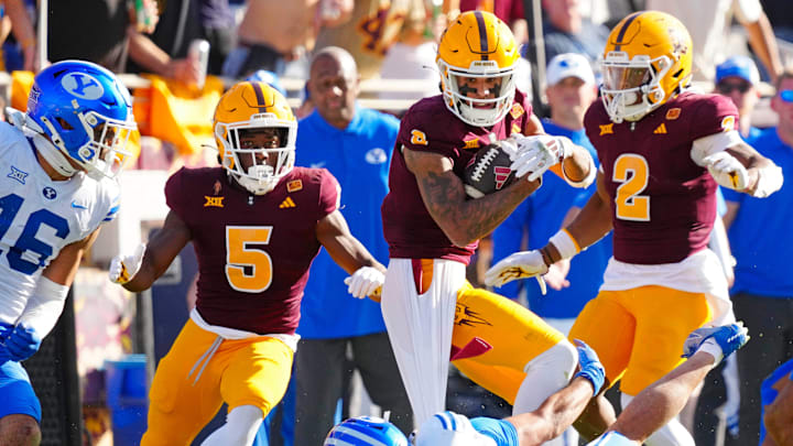 Arizona State wide receiver Jordyn Tyson (0) runs downfield after a catch against BYU safety Raider Damuni (3) during the first half at Mountain America Stadium in Tempe on Nov. 23, 2024.