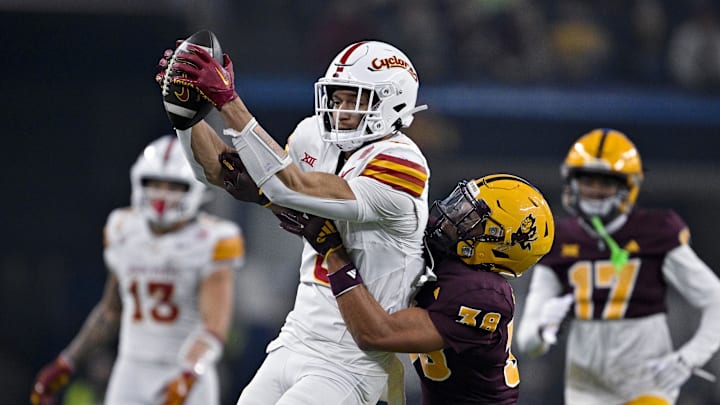 Dec 7, 2024; Arlington, TX, USA; Iowa State Cyclones wide receiver Jayden Higgins (9) catches a pass in front of Arizona State Sun Devils defensive back Kyan McDonald (38) during the second half at AT&T Stadium. Mandatory Credit: Jerome Miron-Imagn Images