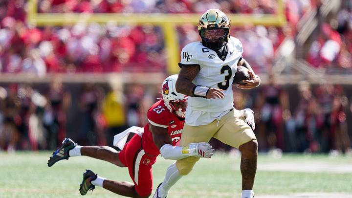 Sep 26, 2026; Louisville, Kentucky, USA;  Louisville Cardinals linebacker Benjamin Perry (23) tackles Wake Forest Demon Deacons quarterback Gio Lopez (3) during the fourth quarter against the Wake Forest Demon Deacons at L&N Federal Credit Union Stadium.  Mandatory Credit: Chris Carter-Imagn Images