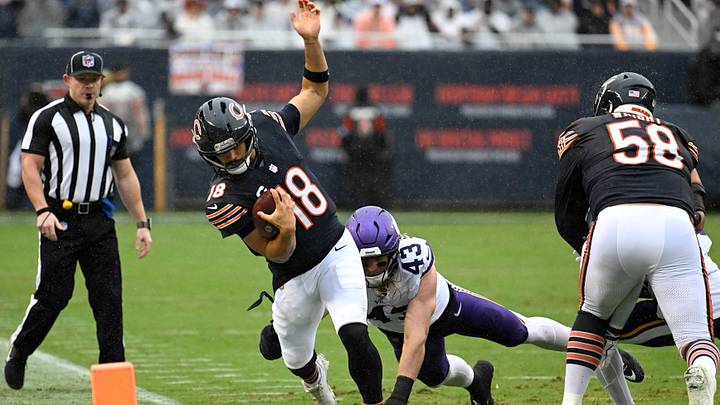 Sep 20, 2026; Chicago, Illinois, USA;  Chicago Bears quarterback Caleb Williams (18) scrambles out of bounds against Minnesota Vikings linebacker Andrew Van Ginkel (43) during the first quarter at Soldier Field.  Mandatory Credit: Matt Marton-Imagn Images