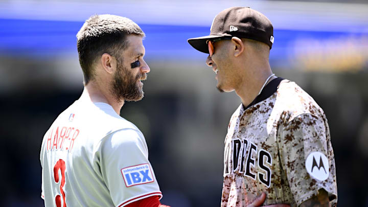Jul 13, 2025; San Diego, California, USA; Philadelphia Phillies first baseman Bryce Harper (3) talks with San Diego Padres third baseman Manny Machado (13) during the fifth inning at Petco Park. Mandatory Credit: Denis Poroy-Imagn Images