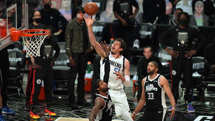 Jun 6, 2021; Los Angeles, California, USA; Dallas Mavericks center Boban Marjanovic (51) moves in for a basket against Los Angeles Clippers guard Paul George (13) and forward Nicolas Batum (33) during the second half in game seven of the first round of the 2021 NBA Playoffs. at Staples Center. Mandatory Credit: Kirby Lee-Imagn Images Jun 6, 2021; Los Angeles, California, USA; Dallas Mavericks center Boban Marjanovic (51) moves in for a basket against Los Angeles Clippers guard Paul George (13) and forward Nicolas Batum (33) during the second half in game seven of the first round of the 2021 NBA Playoffs. at Staples Center. Mandatory Credit: Kirby Lee-Imagn Images