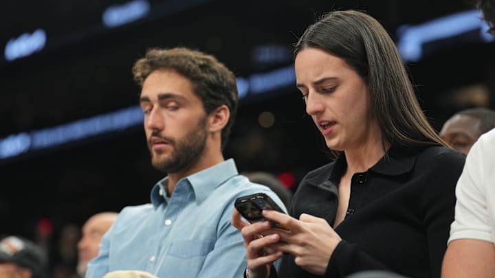 Nov 30, 2024; Phoenix, Arizona, USA; Indiana Fever player Caitlin Clark attends the game between the Phoenix Suns and the Golden State Warriors during the first half at Footprint Center. Mandatory Credit: Joe Camporeale-Imagn Images