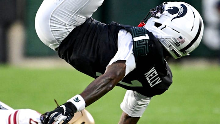Michigan State's Omari Kelly is flipped and fumbles out of bounds after trying to jump Boston College's Omar Thornton during the first quarter on Saturday, Sept. 6, 2025, at Spartan Stadium in East Lansing.