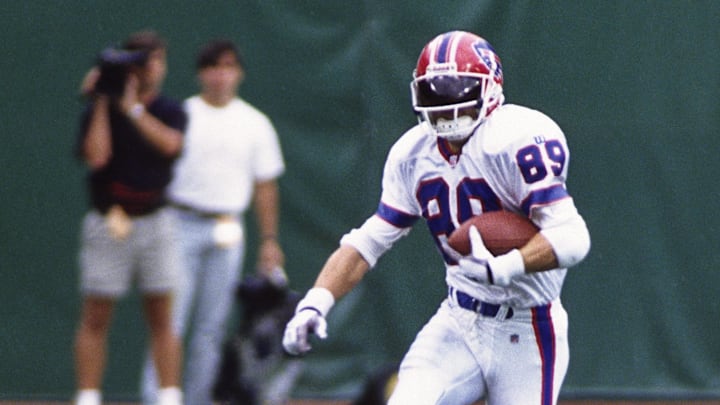Sep 7, 1997; East Rutherford, NJ, USA; FILE PHOTO; Buffalo Bills receiver Steve Tasker (89) carries the ball past New York Jets players Fred Baxter (84) and Richie Anderson (20) at Giants Stadium. Sep 7, 1997; East Rutherford, NJ, USA; FILE PHOTO; Buffalo Bills receiver Steve Tasker (89) carries the ball past New York Jets players Fred Baxter (84) and Richie Anderson (20) at Giants Stadium.