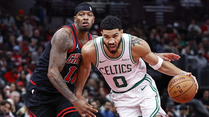 Nov 29, 2024; Chicago, Illinois, USA; Boston Celtics forward Jayson Tatum (0) drives to the basket against Chicago Bulls forward Torrey Craig (13) during the second half at United Center. Mandatory Credit: Kamil Krzaczynski-Imagn Images