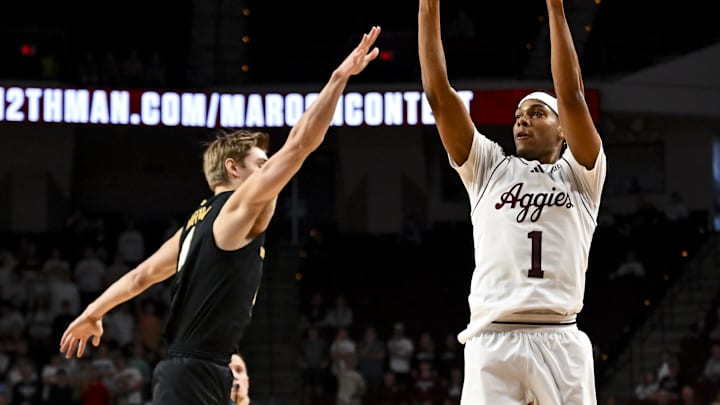 Feb 26, 2025; College Station, Texas, USA; Texas A&M Aggies guard Zhuric Phelps (1) shoots a three point basket over Vanderbilt Commodores guard Tyler Nickel (5) during the first half at Reed Arena. Feb 26, 2025; College Station, Texas, USA; Texas A&M Aggies guard Zhuric Phelps (1) shoots a three point basket over Vanderbilt Commodores guard Tyler Nickel (5) during the first half at Reed Arena.