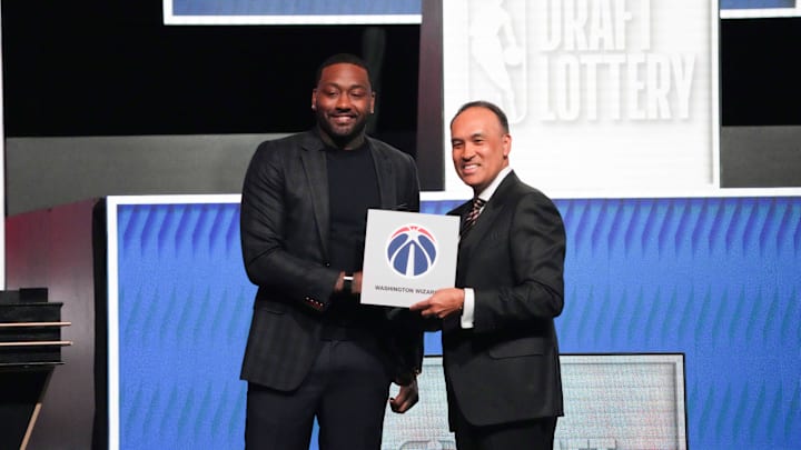 May 10, 2026; Chicago, IL, USA; Mark Tatum the NBA Deputy Commissioner and Washington Wizard (left) guard John Wall pose for photos after Wizards won the 2026 NBA Draft Lottery at Navy Pier. Mandatory Credit: David Banks-Imagn Images
