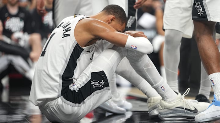 Apr 21, 2026; San Antonio, Texas, USA; San Antonio Spurs forward Victor Wembanyama (1) reacts after falling to the ground during the first half of game two of the first round of the 2026 NBA Playoffs against the Portland Trail Blazers at Frost Bank Center. Mandatory Credit: Scott Wachter-Imagn Images